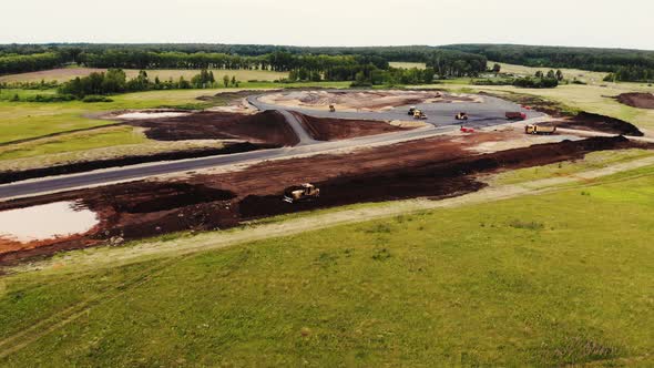 Aerial View of the Yellow Road Rollers That Lay the Asphalt of the Test Ground for Cars