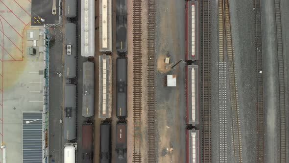 Top Down Aerial of Train Cars Parked in Railway Station