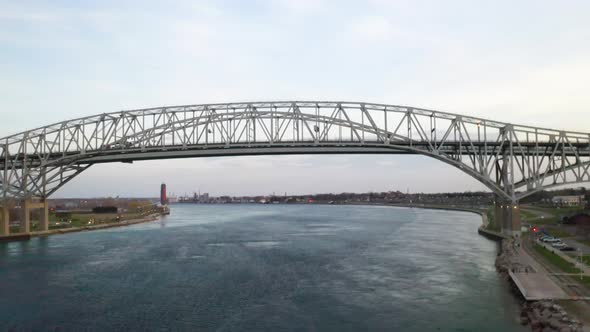 Blue Water Bridge connecting Port Huron, Michigan USA and Sarnia, Ontario Canada in the evening dron