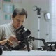 An Asian man is setting up a camera rig  - VideoHive Item for Sale
