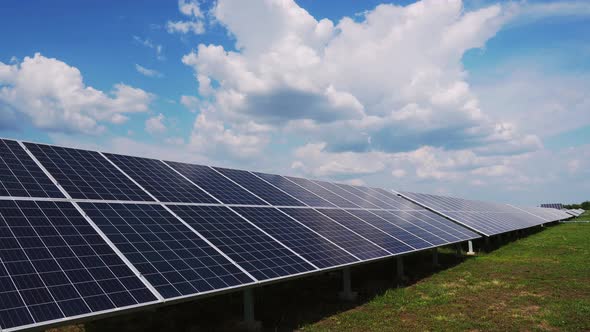 Ecological modules of solar power plant in the fields green energy at sunset landscape