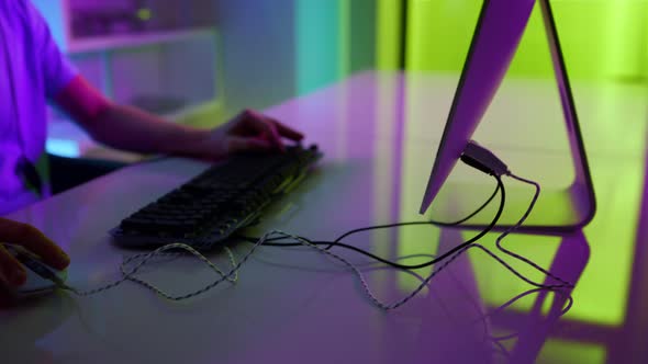 Closeup Neon Hands Using Gaming Equipment at Home