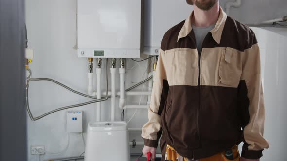 Male Plumber Posing for Camera in Bathroom