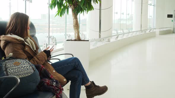 Girl With Smartphone Waiting For Departure 7