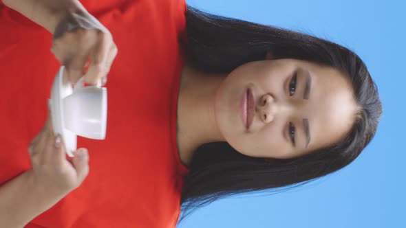 Young Woman Drinking Coffee