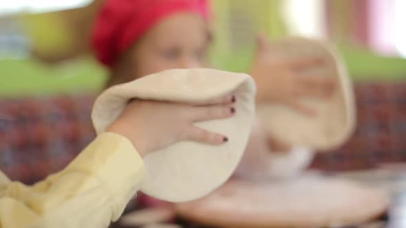 Children make pizza. Master class for children on cooking Italian pizza.