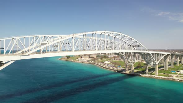 Blue Water Bridge connecting Port Huron, Michigan USA and Sarnia, Ontario Canada with droneing up.