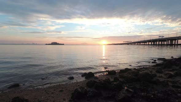 Timelapse sunrise Penang Bridge view from rock stone