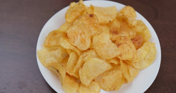Potato chip on white plate