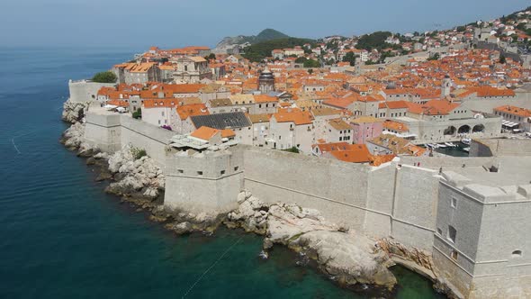 Aerial drone rotating shot over the old fortress along the old town of Dubrovnik, Croatia with the v