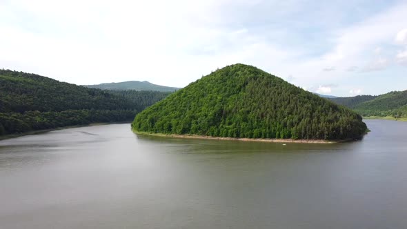 Hill With Forest By The Lake, Aerial View