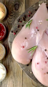 Fresh Raw Chicken Breast Fillets Sprinkled with Peppercorns Rosemary Sauces Rotates Slowly