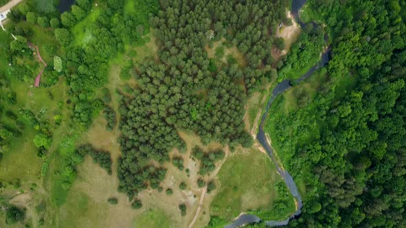 Beautiful aerial birdseye view of Sventaja river in sunny summer day, wide angle high altitude drone