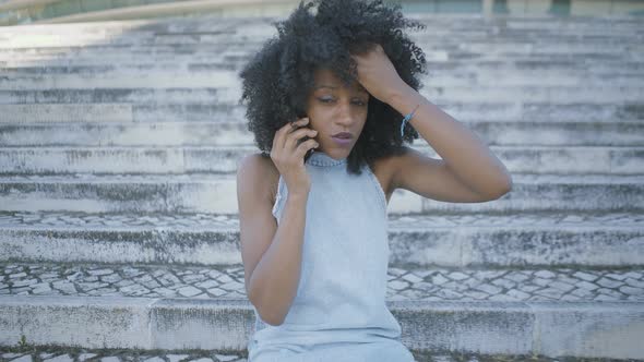 Woman Talking on Phone, Looking Disappointed, Gesticulating