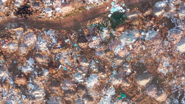 Open illegal dump: abandoned piles of rubble, medical waste and debris - fly dumping (tipping)