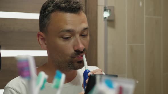 Handsome Guy Brushes Teeth