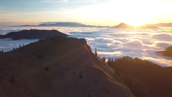 Sunrise in Wild Mountains Above Foggy Clouds in Sunny Autumn Alpine Nature Landscape