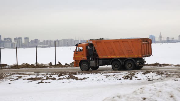 dump truck drives construction site