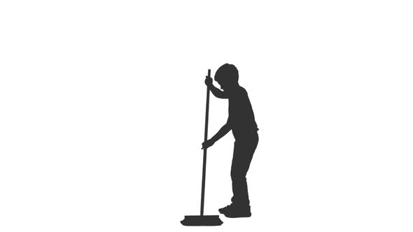 Silhouette of Little Boy Sweeps Floor With Mop