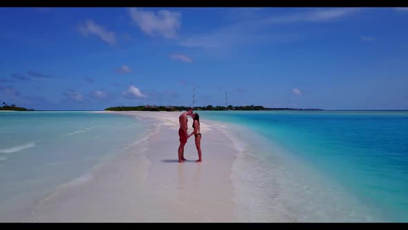 Romantic couple suntan on exotic coastline beach holiday by blue sea and white sandy background of t