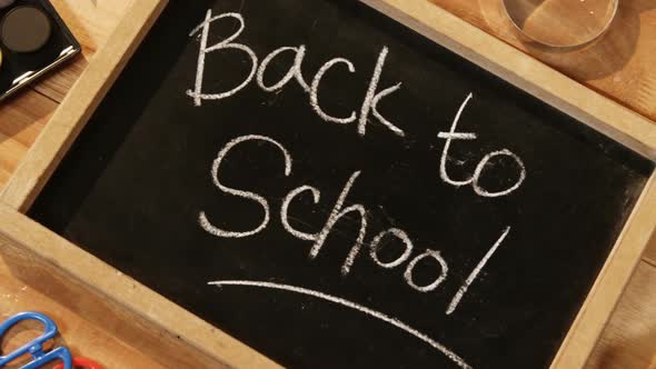 Close-up of chalkboard with colored pencil and crayon