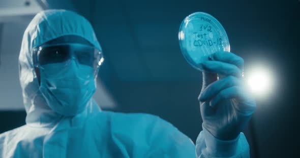Scientist Examining Coronavirus Sample in Laboratory