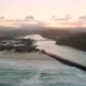 Aerial Descend Over Tallebudgera Creek Mouth Facing the Sun at Sunset - VideoHive Item for Sale