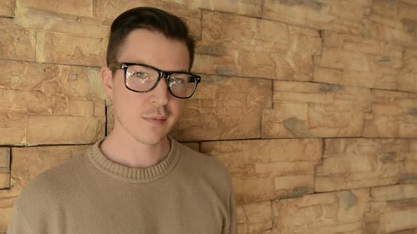 Young Handsome Man Against Brick Wall