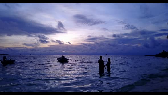 Man and lady happy together on tropical lagoon beach wildlife by shallow lagoon and white sand backg