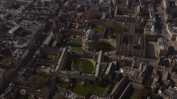 Tight circling drone shot of Bodleian Library Radcliffe camera Oxford University at midday