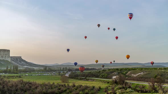 Beautiful Rocky Landscape of Crimea with Colorful Hotair Balloons Balloons Flying on Sunset HDR Time