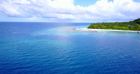 Beautiful birds eye island view of a white sand paradise beach and blue sea background in high resol