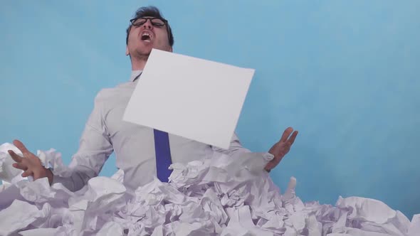 Furious Man Office Worker Leans Out of a Large Heaps of Crumpled Paper Slow Mo