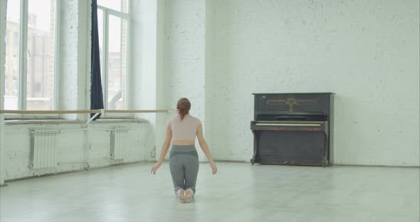 Artistic Gymnast Training Short Routines in Studio