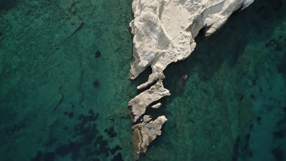 Rocky archipelago stretches in the crystal-clear waters of the Mediterranean. Summertime Milos Greec