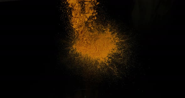 Turmeric, curcuma longa, Powder falling against Black Background, Indian Spice, Slow Motion 4K
