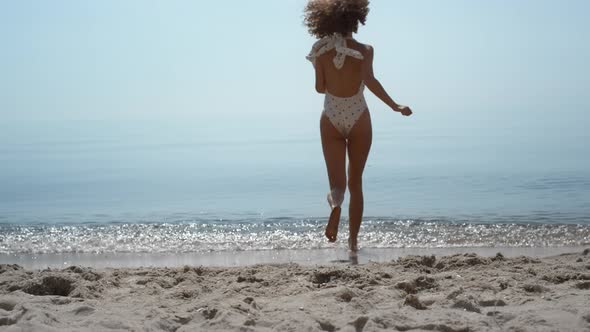 Joyful Girl Running Swim in Beautiful Sea Summer Day