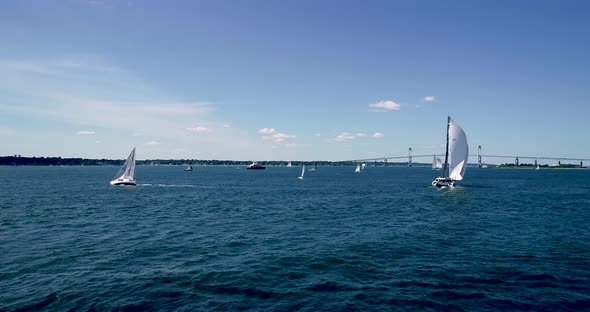 Sailboats entering and leaving Mt. Hope Bay in Newport Rhode Island as well as returning from Block