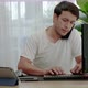young man in casual clothes is stressed out of working from home on a desk with a computer and table - VideoHive Item for Sale