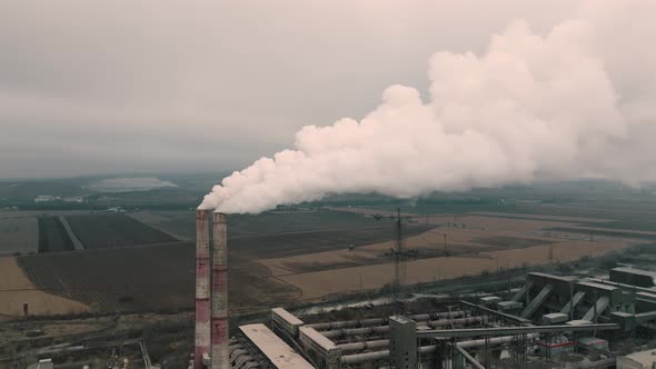 Aerial View of Oil and Gas Petrochemical Base Industry and Oil Refinery at Sunset in Cloudy Weather