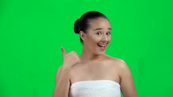 Young Cheerful Woman Showing Thumbs Up, Gesture Like, Isolated on Green Screen at Studio. Slow