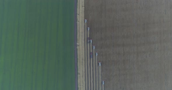 Aerial shot of threshers harvesting