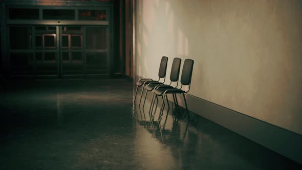 Empty Corridor in Hospital with Chairs