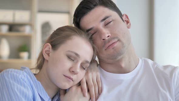 Close Up of Sleeping Young Couple on Couch