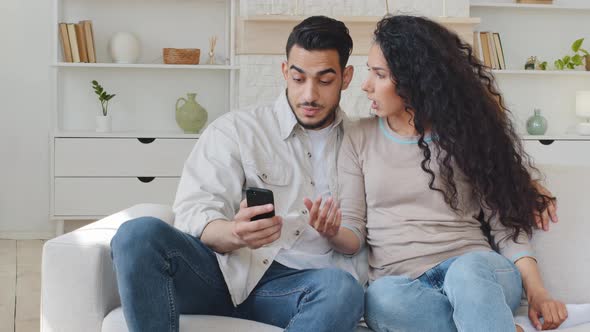 Spanish Couple Man Hispanic Husband Boyfriend and Spaniard Woman Curly Wife Girlfriend Sitting on