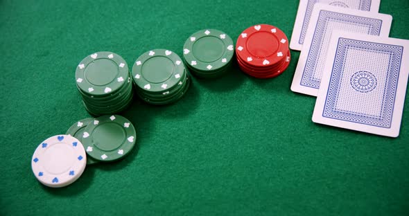 Playing cards and casino chips on poker table 4k