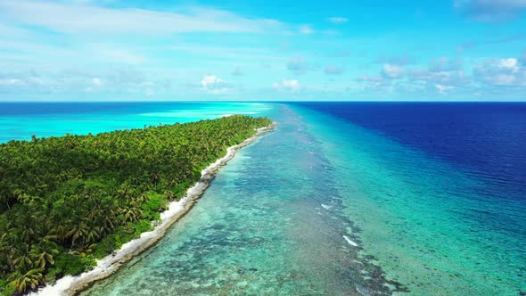 Aerial drone shot sky of luxury sea view beach adventure by turquoise sea with white sandy backgroun