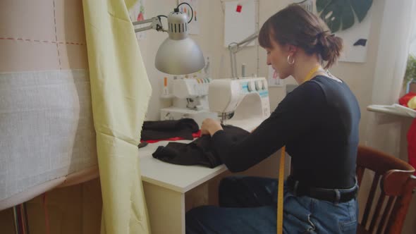 Seamstress Using Sewing Machine at Work