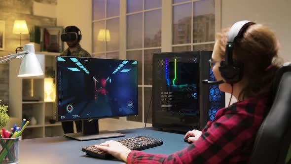 Woman with Headphones Relaxing Playing Computer Games