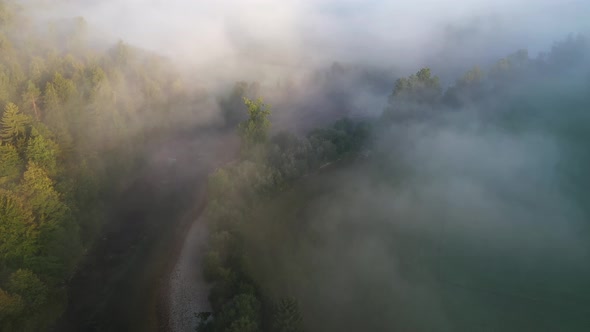 Flying above the river and fog